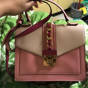 Aldo Pink hand bag with crossbody strap.